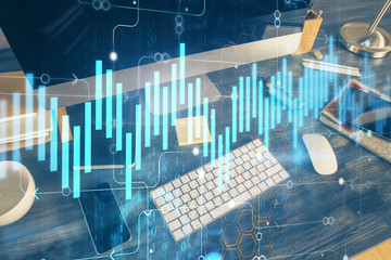 Double exposure of forex graph and work space with computer. Concept of international online trading.