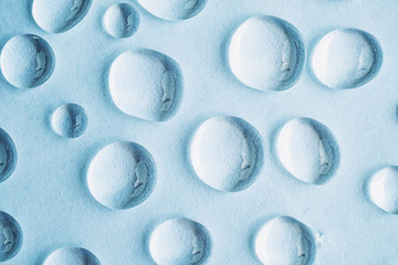 Water drops on aqua abstract background, top view