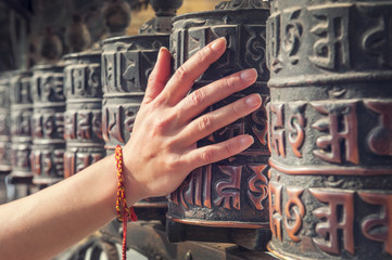 Spinning Buddhist prayer drums or prayer wheels at a monastery