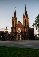 Fototapeta na wymiar Roman Catholic church, organ hall during sunset, Krasnoyarsk, Russia