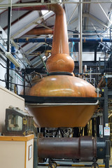 Copper stills in a whisky distillery in the Scottish highlands