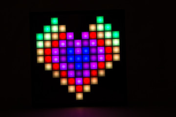 Heart closeup on a black background. Valentine's Day.