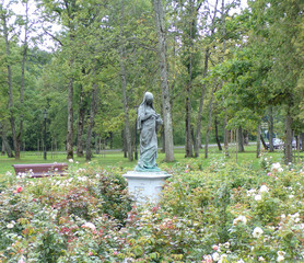 Statue of a woman in a garden