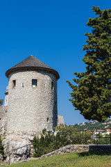 Fototapeta premium Trsat castle tower view in Rijeka, Croatia, beautiful castle surrounded by trees on summer day, ancient Illyrian and Roman fortress - Image