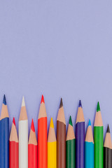 Color Pencils on violet Background for Projects and Announcements