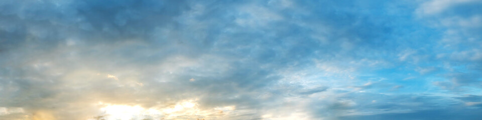 Dramatic vibrant color with beautiful cloud of sunrise and sunset on a cloudy day. Panoramic image.