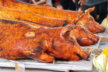 Pigs roast cooked over hot coals, grilled pig on the fire