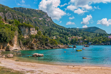 Beautiful landscape with sea–lagoon with turquoise water, mountains and cliffs, green trees,...