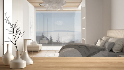 Wooden table top or shelf with minimalistic modern vases over blurred modernbedroom with big panoramic window, shower and parquet floor, minimalist architecture interior design