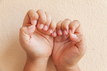 Nail clippers at your finger. Close up of fingernail cutting. Dirty nails. Long finger nails.
