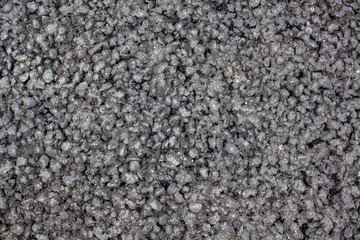coarse gray asphalt closeup. rough surface texture