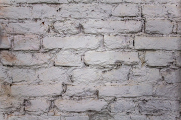 old damaged white brick wall. rough surface texture