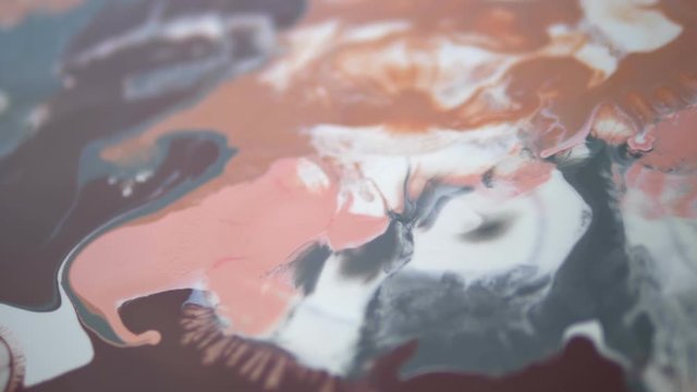 a drop of alcohol drops from a pipette onto a canvas with acrylic paint. the interaction of alcohol and water-based acrylics. Liquid marble texture luxury. Fluid art.