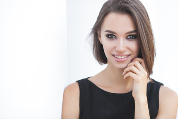 Beautiful elegant woman outdoors. Lady in black dress. Young female classic portrait.