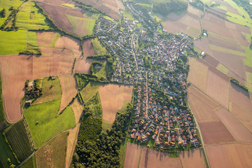 Aerial view at a landscape in Germany, Rhineland Palatinate near Bad Sobernheim with the river Nahe, meadow, farmland, forest, hills, mountains