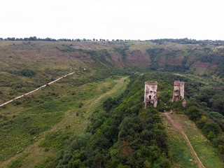 Fototapeta na wymiar Ruins of the castle in Nirkov, towers of the Chervonograd castle, Ukraine. Nirkov, Dzhurin waterfall.