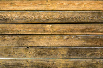 Naklejka premium Background from old, shabby light brown boards arranged horizontally with space for text.