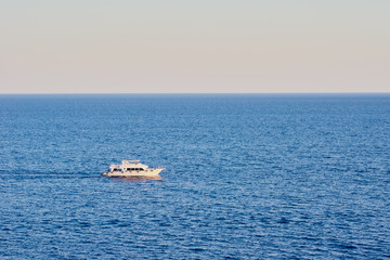 Trolling boat in a blue water of ocean