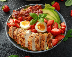 Chicken Cobb salad with strawberries, bacon, avocado and boiled eggs