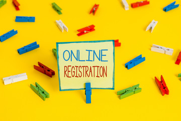 Text sign showing Online Registration. Business photo text System for subscribing or registering via the Internet Colored clothespin papers empty reminder yellow floor background office