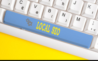 Text sign showing Local Seo. Business photo text helps businesses promote products and services to local customers White pc keyboard with empty note paper above white background key copy space