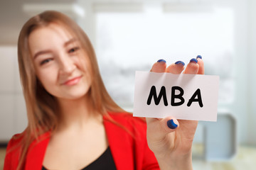 Business, technology, internet and networking concept. Young entrepreneur showing keyword: MBA