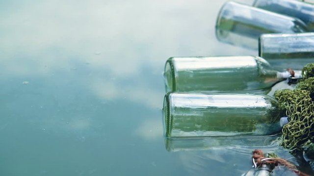Bottles connected with notes inside float by the lake. Quests, games, adventures.
