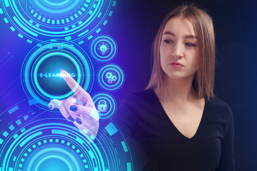 The concept of business, technology, the Internet and the network. A young entrepreneur working on a virtual screen of the future and sees the inscription: E-learning