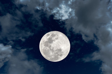 Full moon with white clouds in the sky.
