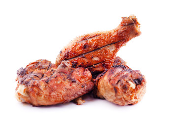 grilled chicken meat legs to a golden crust on a white background