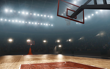 Basketball court with hoop. Floodlit sports arena.