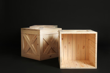 Group of wooden crates on black background