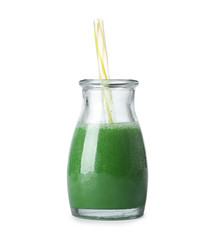 Fresh wheat grass juice and straw in glass bottle on white background