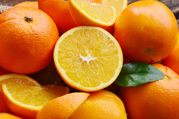 A lot of An orange, whole and split in sack bag. Sweet orange is the fruit of the citrus.