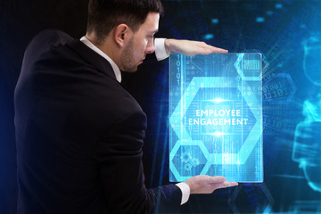 The concept of business, technology, the Internet and the network. A young entrepreneur working on a virtual screen of the future and sees the inscription: Employee engagement