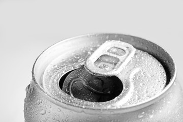 Wet open can on grey background, closeup