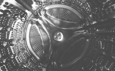 Metal drum washing machine close-up. Wide angle photo