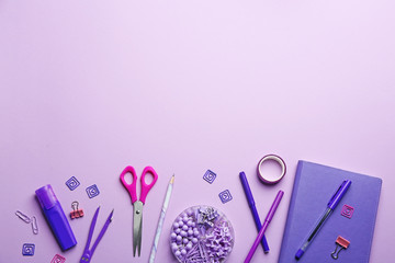 Bright school stationery on lilac background, flat lay. Space for text