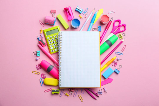 Bright school stationery on pink background, flat lay. Space for text