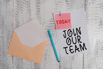 Writing note showing Join Our Team. Business concept for inviting someone to join in your local group or company Envelope blank sheet sticky note ballpoint wooden background