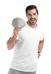 Handsome young man with dollars on white background