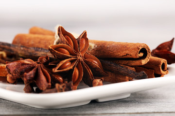 cinnamon, staranise and cloves. winter spices on wooden table