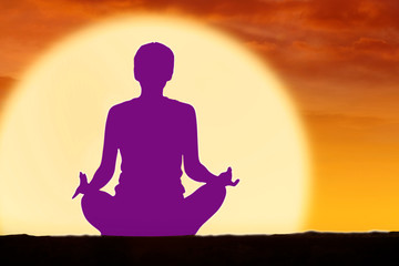 Woman doing yoga with purple color chakra