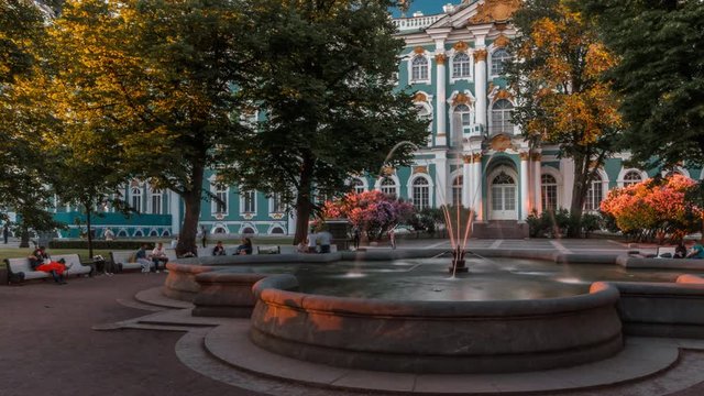 Sunset time-lapse (hyperlapse) with resting people at fountain near Winter Palace 