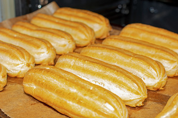 Eclairs on a baking tray