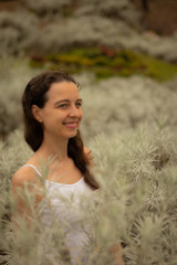 Portrait of happy woman in edelweiss garden. Edelweiss valley in Bali.