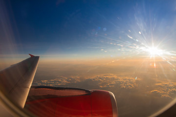 Fototapeta na wymiar View from a plane window above the cloud. 