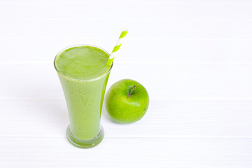Apple smoothie green juice beverage healthy the taste yummy in glass for on white wood background.