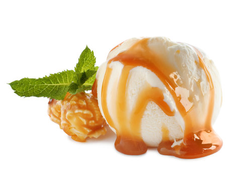 Scoop of delicious ice cream with caramel sauce, mint and popcorn on white background