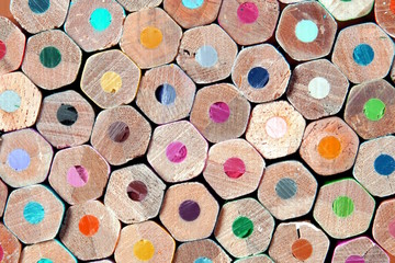 Wooden multicolored pencils all colors.  Colored pencils stacked in rows on top of each other. frame of colored circles background abstract pattern. Office, Education projects, back to school Concept
